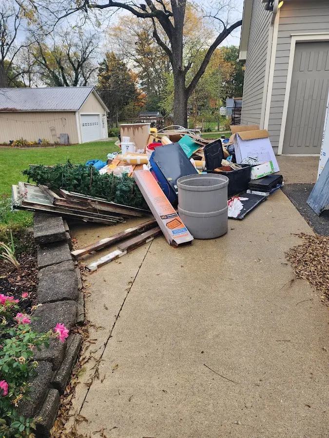 Dumpster being loaded with debris for 3 Yard Dumpster Rental in Jacksboro